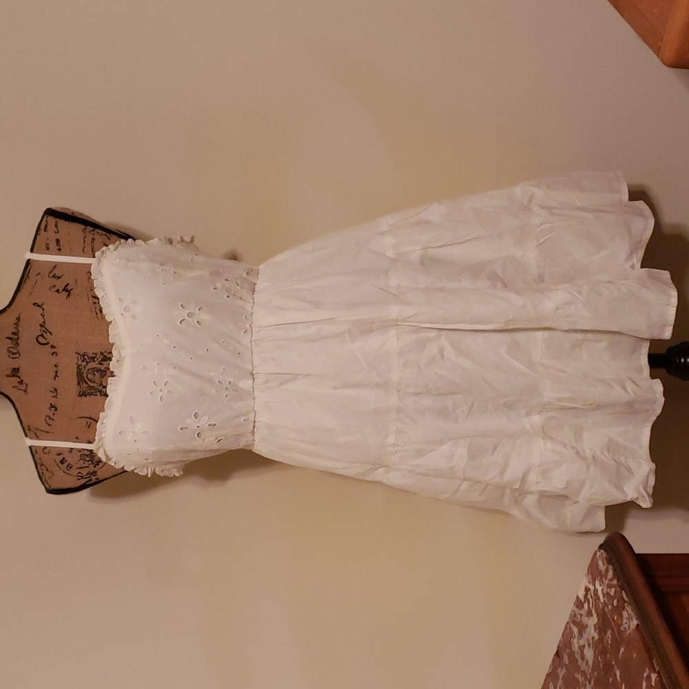 Cream colored flirty dress.